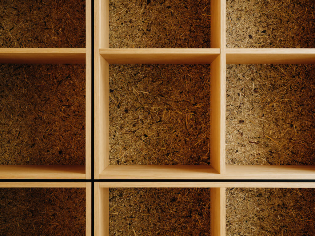 Wooden shelving unit with a textured brown background and black vertical dividers